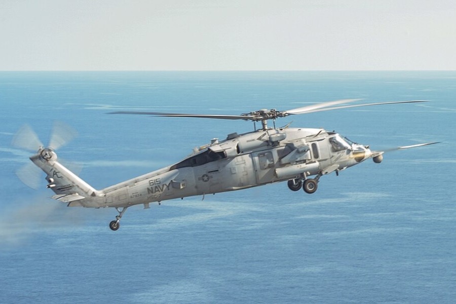 A US Navy MH-60S Sea Hawk fires an APKWS II laser-guided rocket off the Virginia coast.