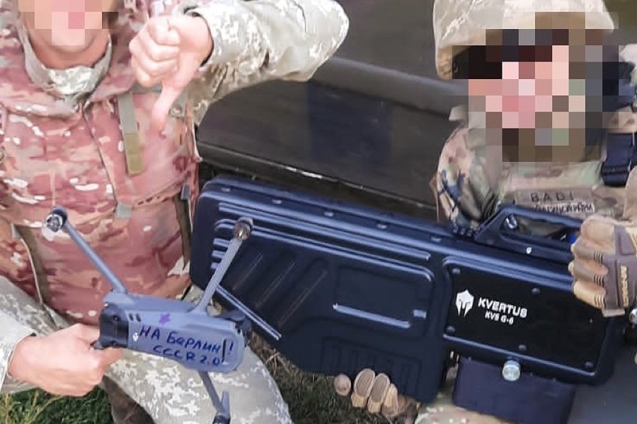 Ukrainian territorial defence soldiers with a Kvertus KVS G-6 jammer and a drone it brought down.