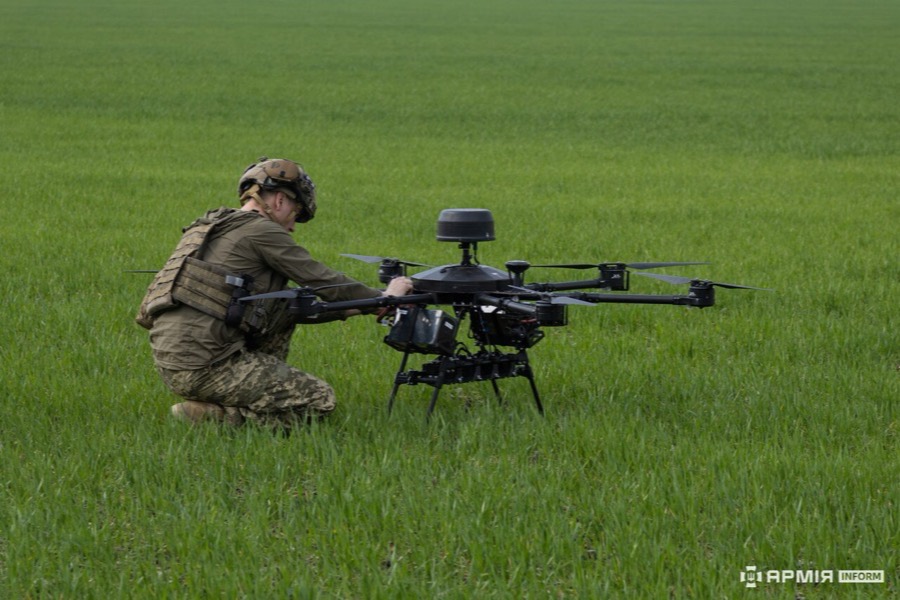 Ukrainian crew with a Vampire bomber drone in the field.